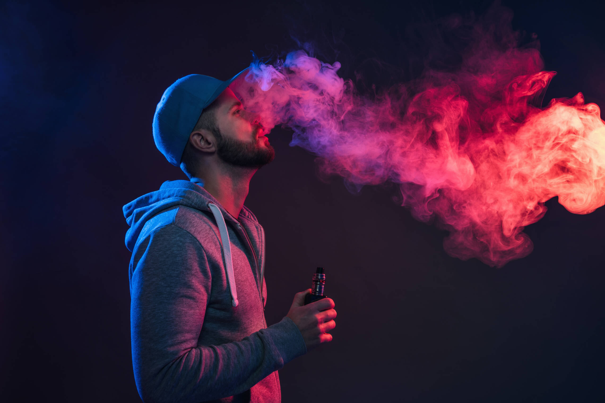 man smoking an electronic cigarette in studio 2026 03 09 05 20 11 utc scaled