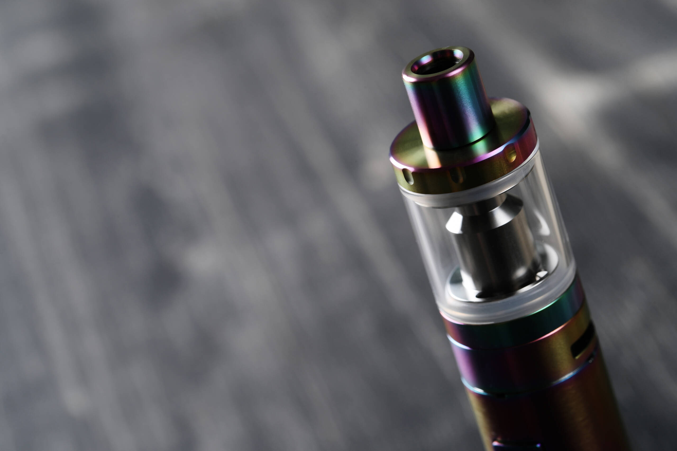 modern iridescent vape pen close up on gray backgr 2026 03 25 03 27 53 utc scaled
